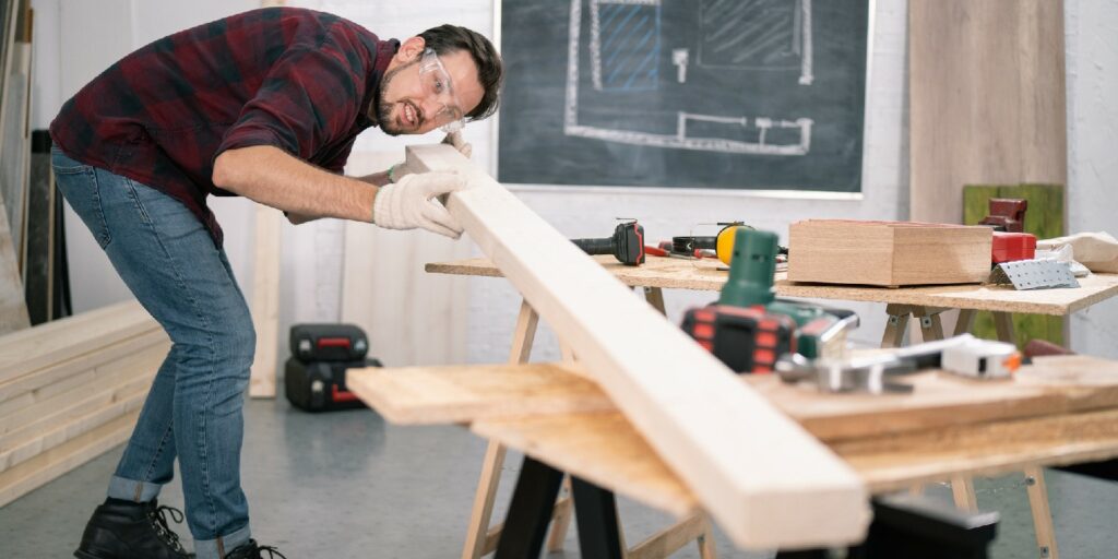 Carpenter checking the quality of the wood