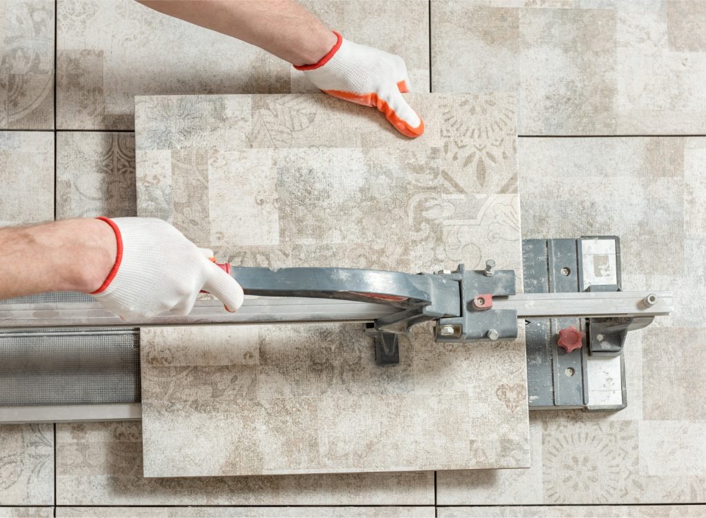 Person cutting ceramic tile