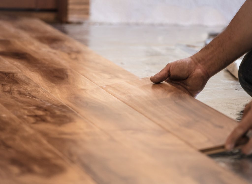 Man installing hardwood flooring