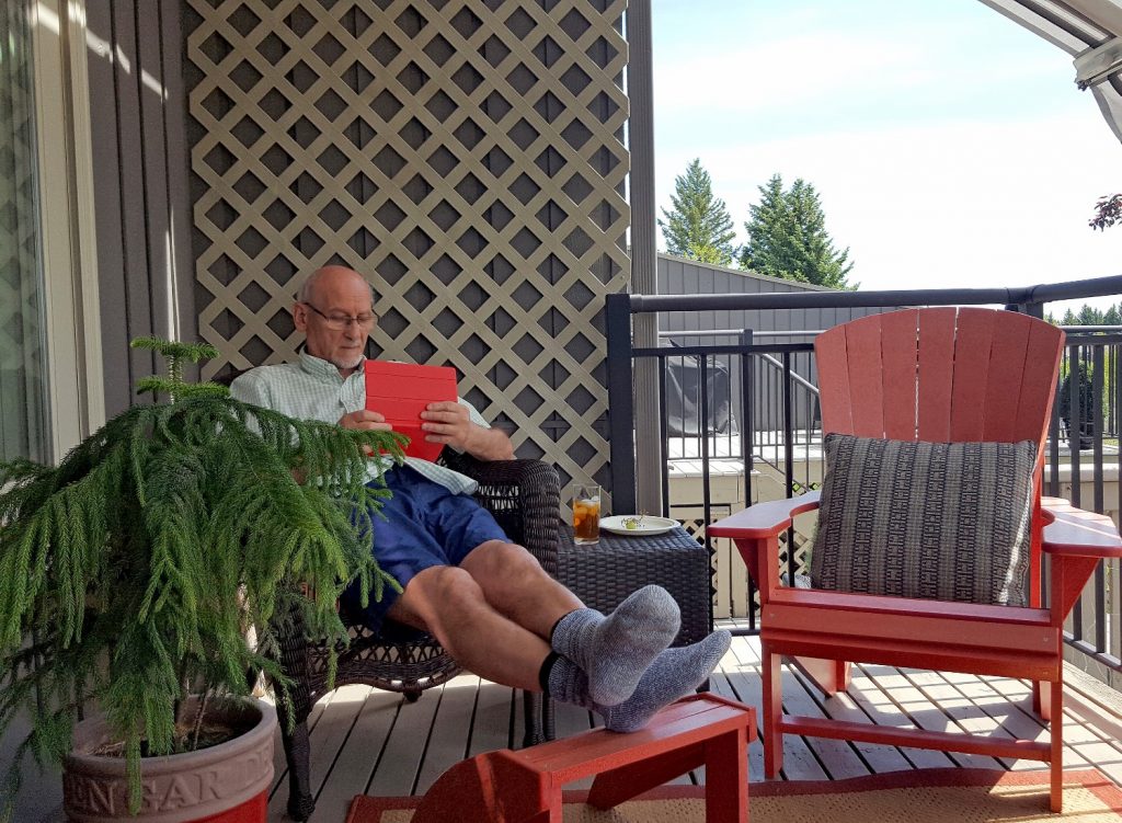 Man sitting on a covered patio