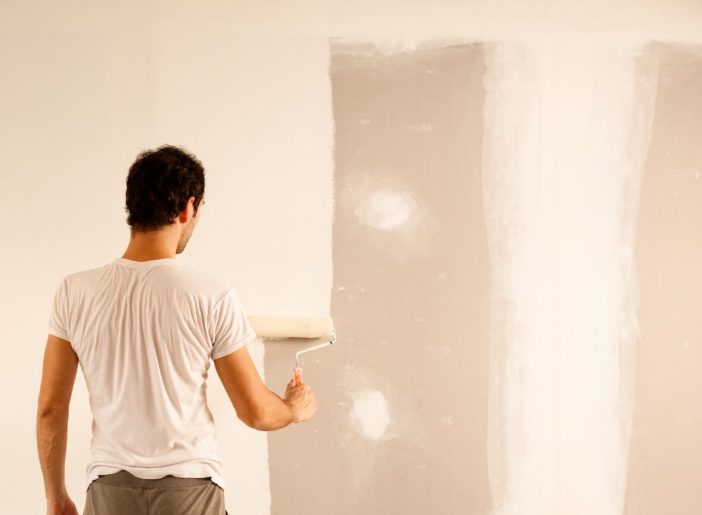 Man painting a wall