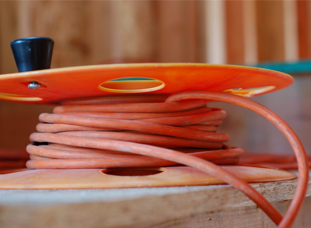 Extension cord wrapped around a cord reel